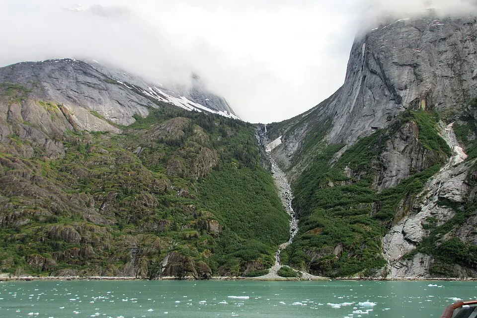 Mountains and a waterfall beside Endicott Arm fjord in Alaska